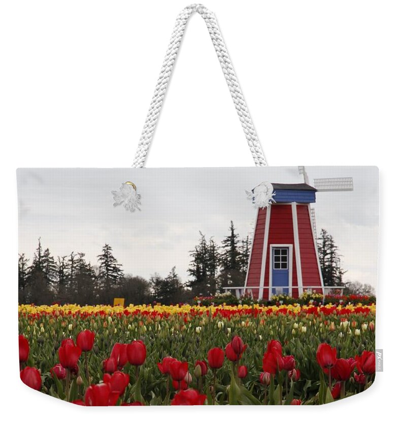 Windmill Weekender Tote Bag featuring the photograph Windmill Red Tulips by Athena Mckinzie