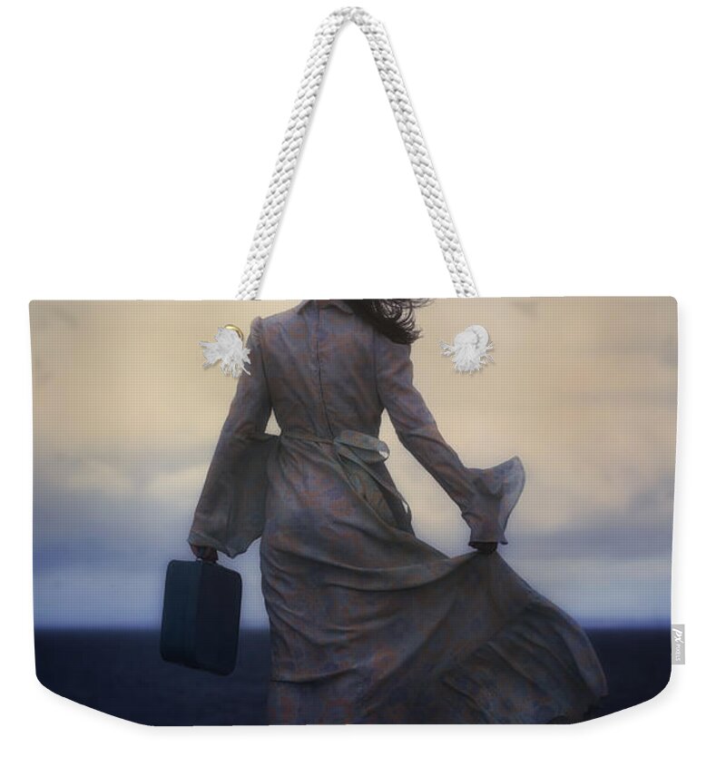 Woman Weekender Tote Bag featuring the photograph Windy Journey by Joana Kruse
