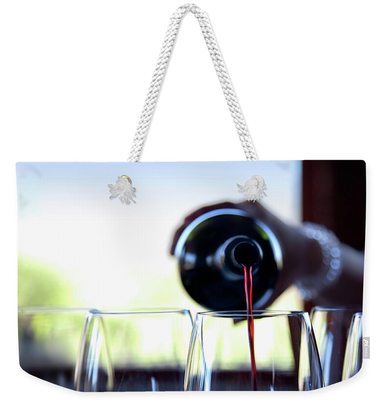 Recreational Pursuit Weekender Tote Bag featuring the photograph Wine Pouring by Nicolamargaret