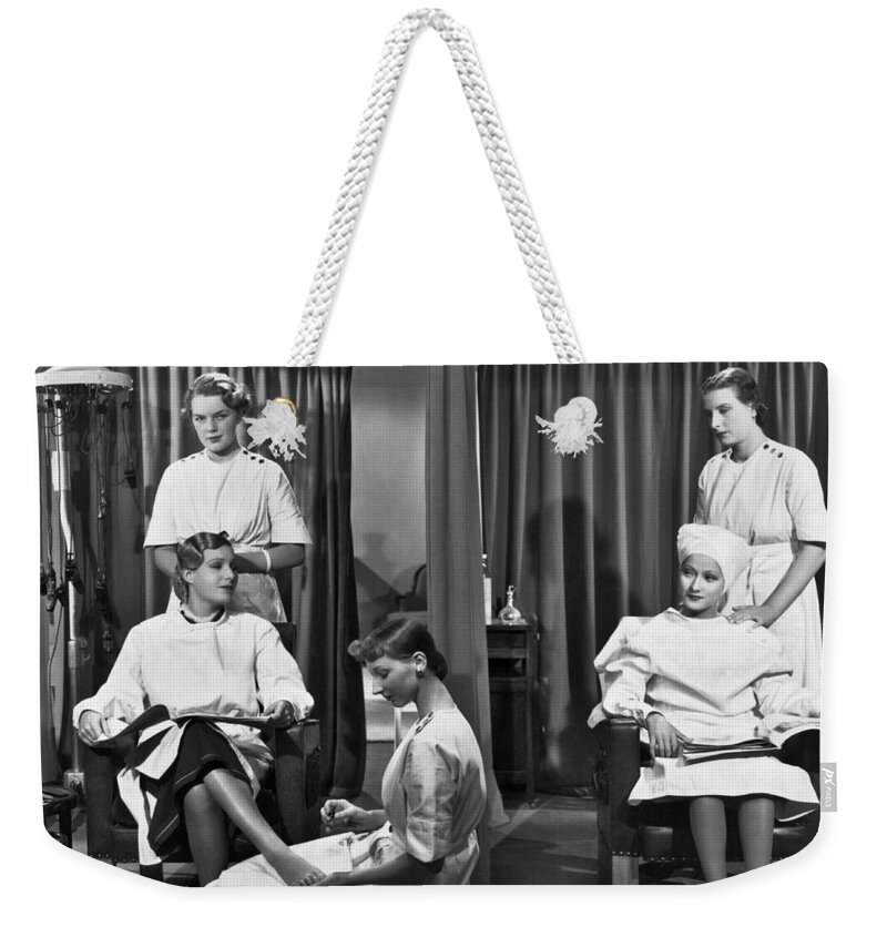 1930s Weekender Tote Bag featuring the photograph Women In A Beauty Salon by Underwood Archives