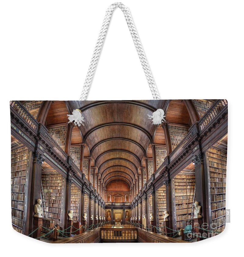 Library Weekender Tote Bag featuring the photograph World Of Books by Evelina Kremsdorf