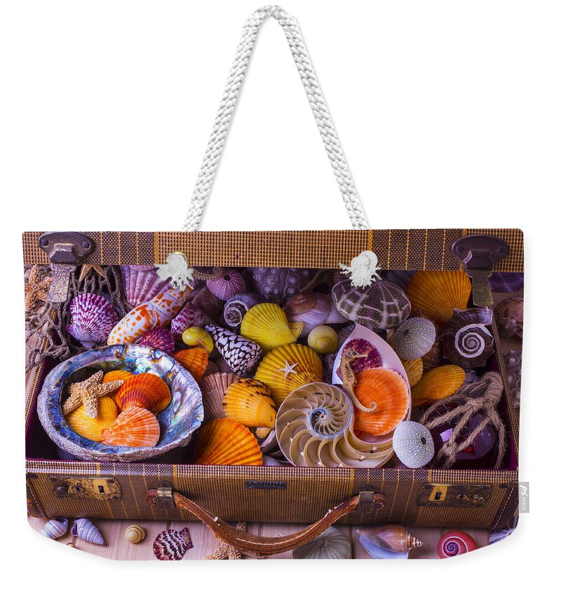 Suitcase Full Sea Shells Travel Weekender Tote Bag featuring the photograph Worn Suitcase Full Of Sea Shells by Garry Gay
