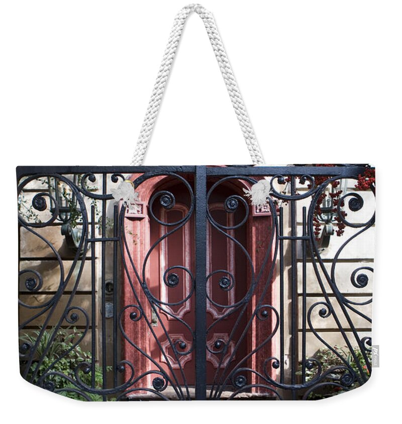 Wrought Iron Weekender Tote Bag featuring the photograph Wrought Iron Gate and Red Door Charleston South Carolina by Jason O Watson