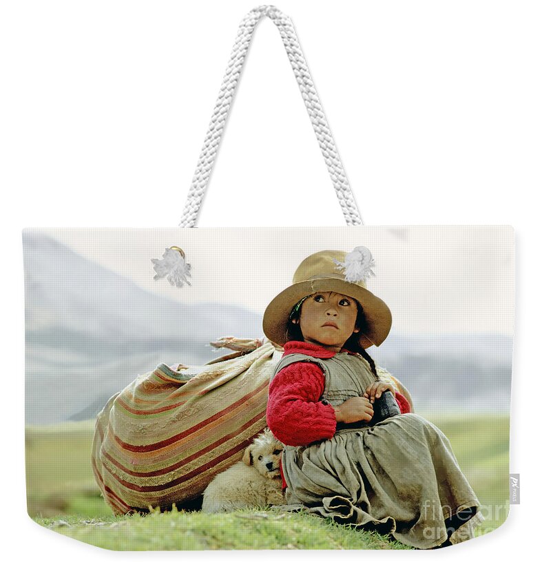 Girl Weekender Tote Bag featuring the photograph Young Girl in Peru by Victor Englebert