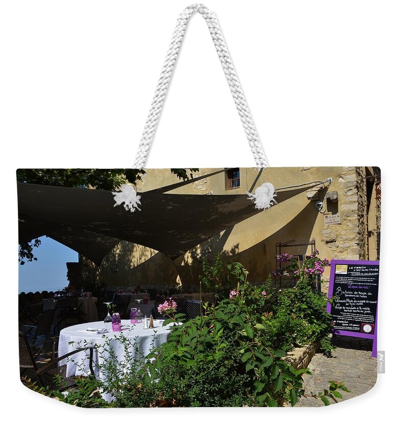 Advertisement Weekender Tote Bag featuring the photograph French restaurant #1 by Dany Lison