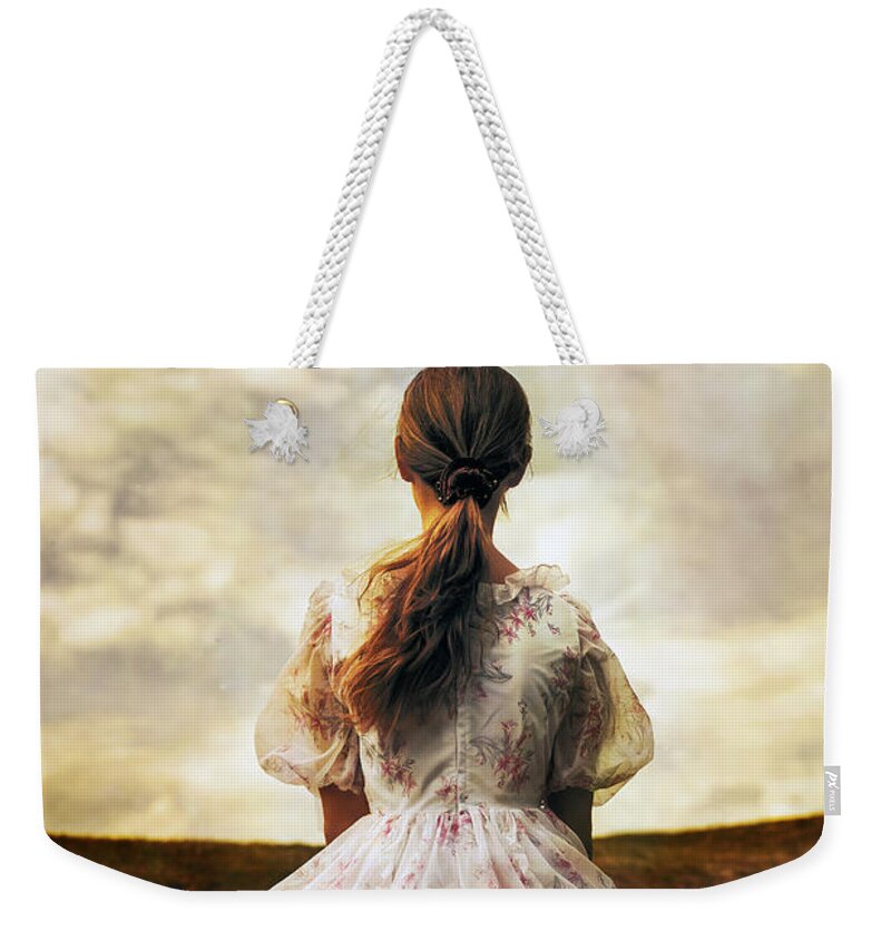 Female Weekender Tote Bag featuring the photograph Woman On A Meadow #1 by Joana Kruse