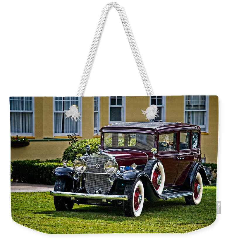 Cadillac Weekender Tote Bag featuring the photograph 1931 Cadillac V12 by Christopher Holmes