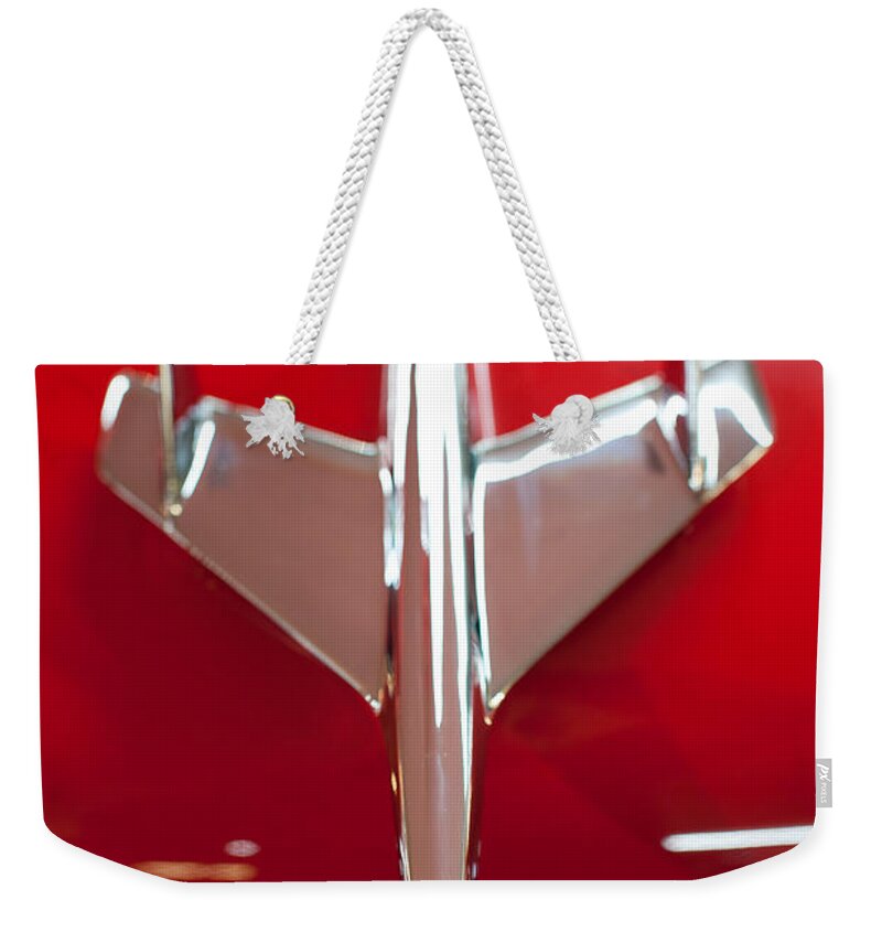 1955 Bel Air Weekender Tote Bag featuring the photograph 1955 Chevy Belair Hood Ornament by Sebastian Musial