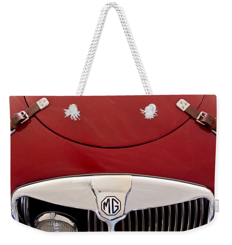 1957 Mg Mga Ex182 Tribute Weekender Tote Bag featuring the photograph 1957 MG MGA Ex182 Tribute Grille Emblem by Jill Reger