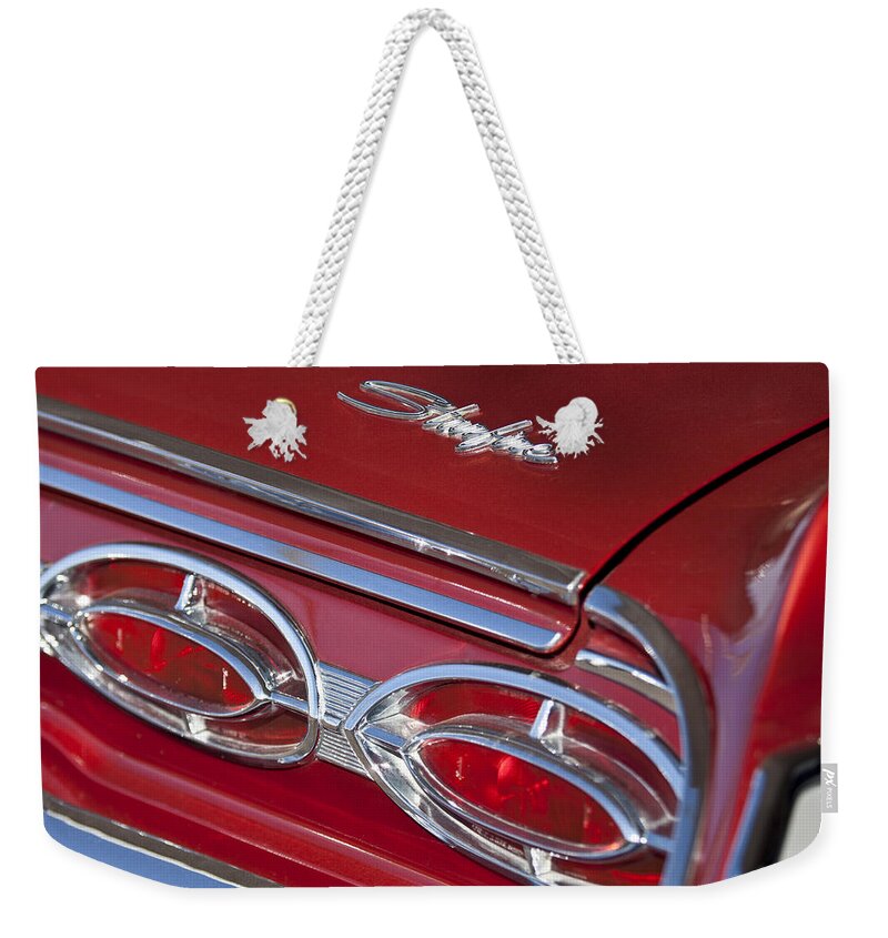 1962 Oldsmobile Starfire Hardtop Weekender Tote Bag featuring the photograph 1962 Oldsmobile Starfire Hardtop Taillights and Emblems by Jill Reger