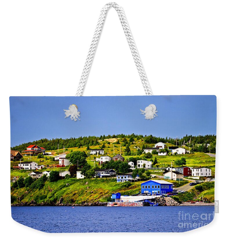 Fishing Weekender Tote Bag featuring the photograph Fishing village in Newfoundland 1 by Elena Elisseeva