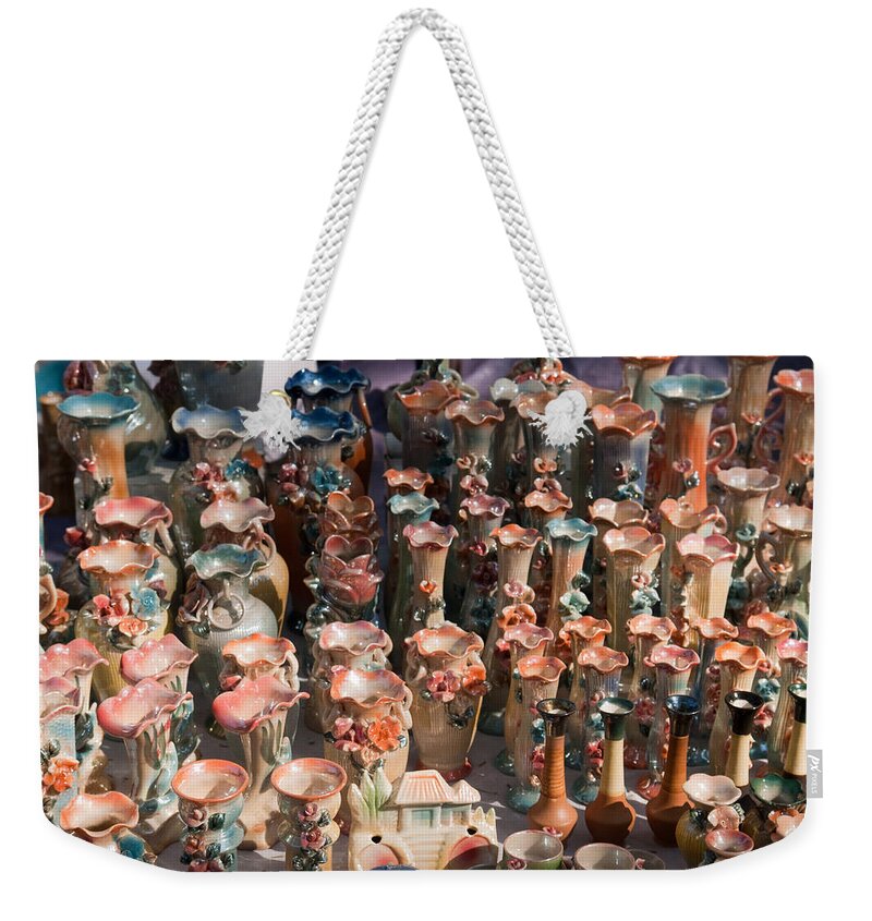 Statues Weekender Tote Bag featuring the photograph A number of clay vases and figurines at the Surajkund Mela by Ashish Agarwal