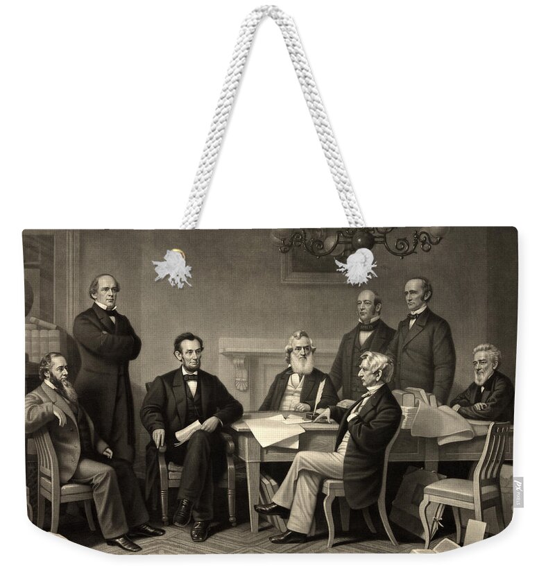 emancipation Proclamation Weekender Tote Bag featuring the photograph Abraham Lincoln at the first reading of the Emancipation Proclamation - July 22 1862 by International Images