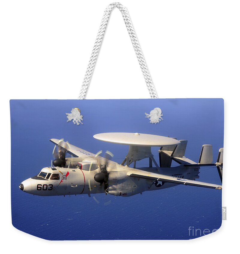 E-2c Hawkeye Weekender Tote Bag featuring the photograph An E-2c Hawkeye Flying Over The Pacific by Stocktrek Images