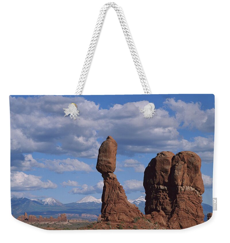 00175041 Weekender Tote Bag featuring the photograph Balanced Rock Under Cloudy Skies Arches by Tim Fitzharris