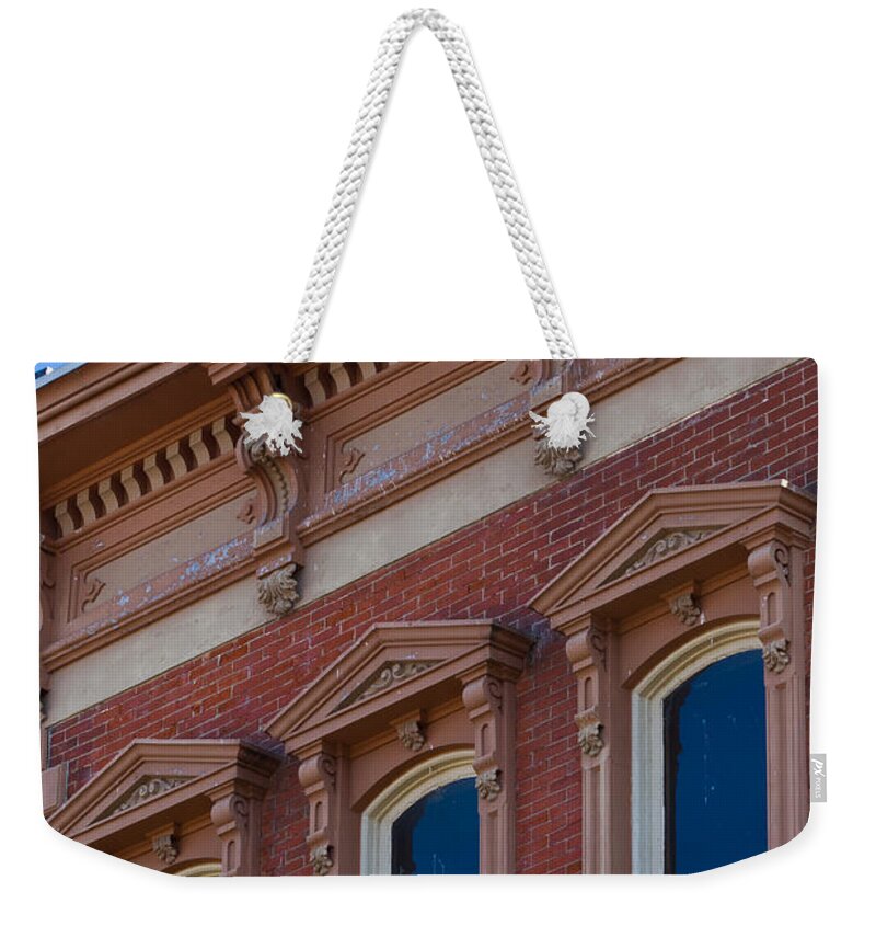 Architectural Features Weekender Tote Bag featuring the photograph Brick Facade in Clarksville TN by Ed Gleichman