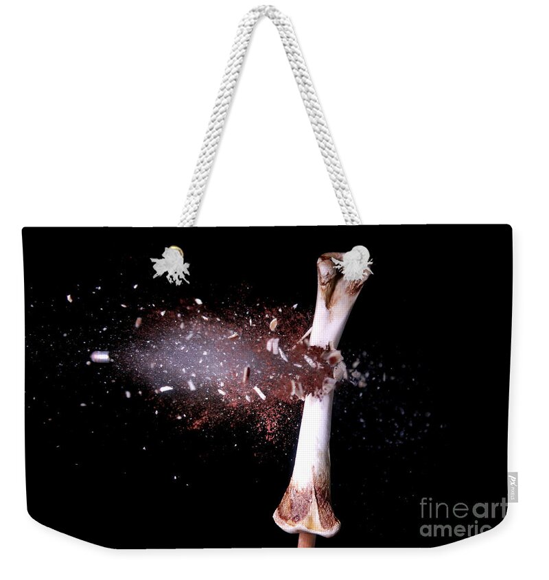 Bone Weekender Tote Bag featuring the photograph Bullet Hitting A Chicken Bone by Ted Kinsman