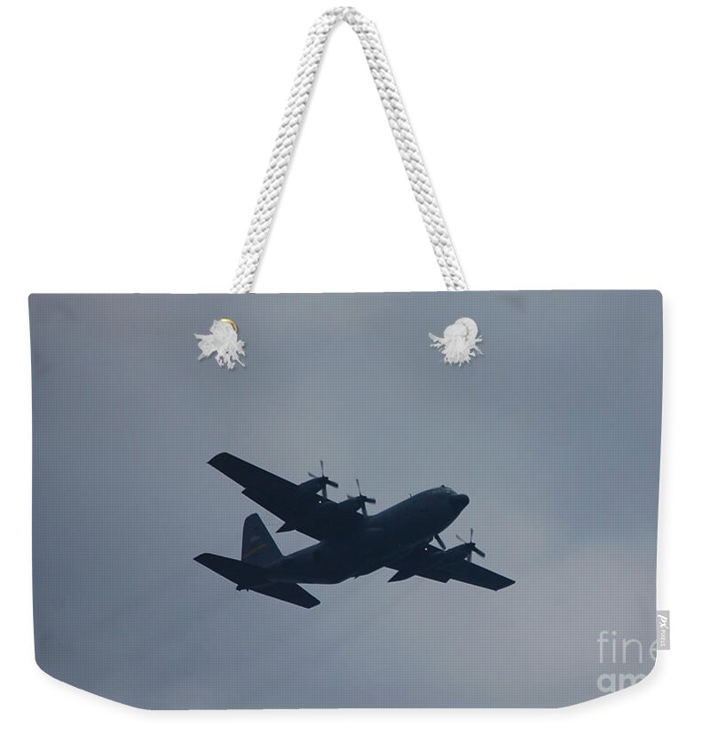 C-130 Weekender Tote Bag featuring the photograph C-130 in Flight by Susan Stevens Crosby