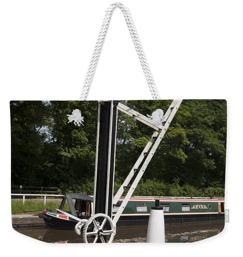 Canal Weekender Tote Bag featuring the photograph Canal wharf crane by Steev Stamford
