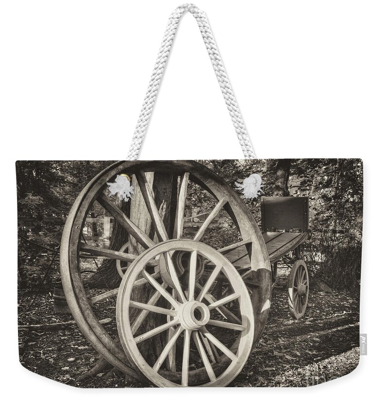 Cart Weekender Tote Bag featuring the photograph Cart wheels mono by Steev Stamford