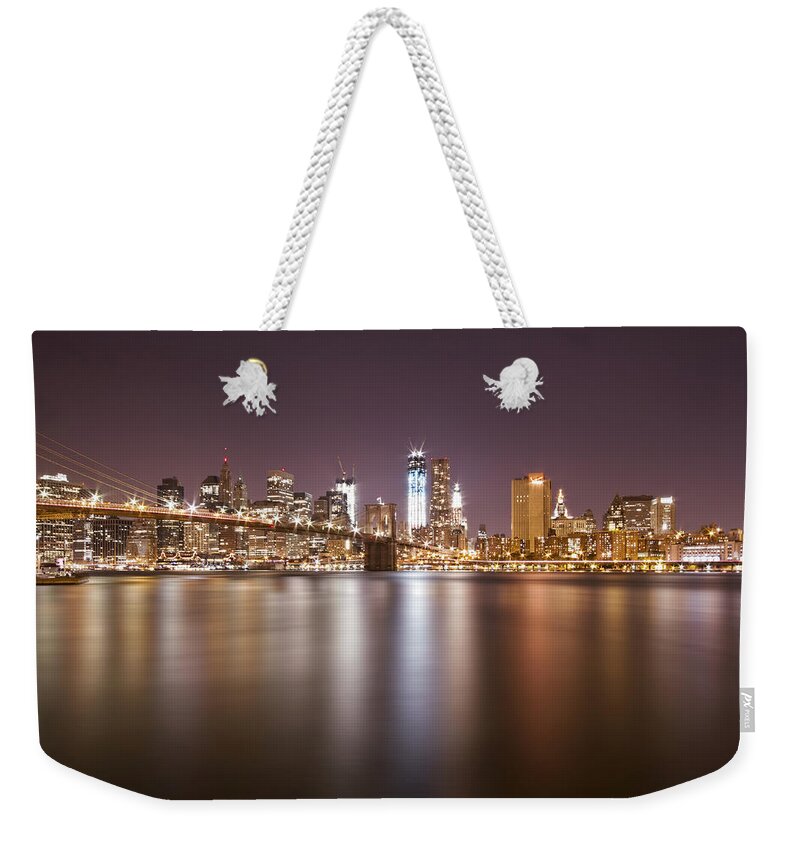 New York Weekender Tote Bag featuring the photograph City Of Blinding Lights by Evelina Kremsdorf