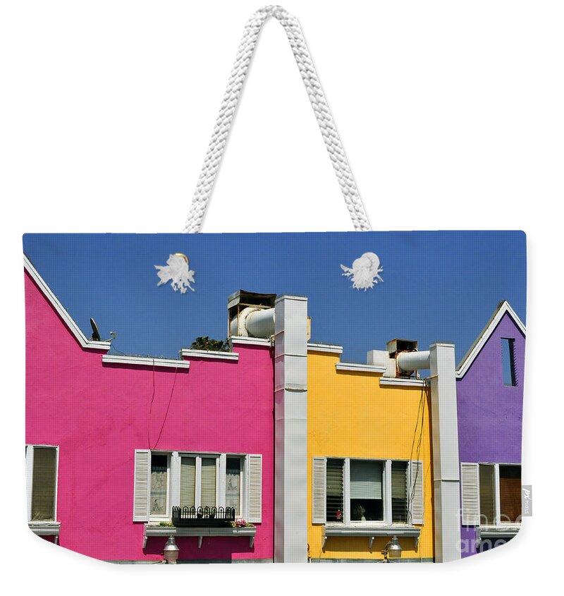 Clay Weekender Tote Bag featuring the photograph Colorful Seaside Shops by Clayton Bruster