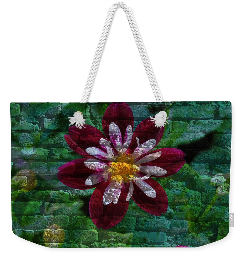 Flora Weekender Tote Bag featuring the mixed media Crazy flower over brick by Eric Liller