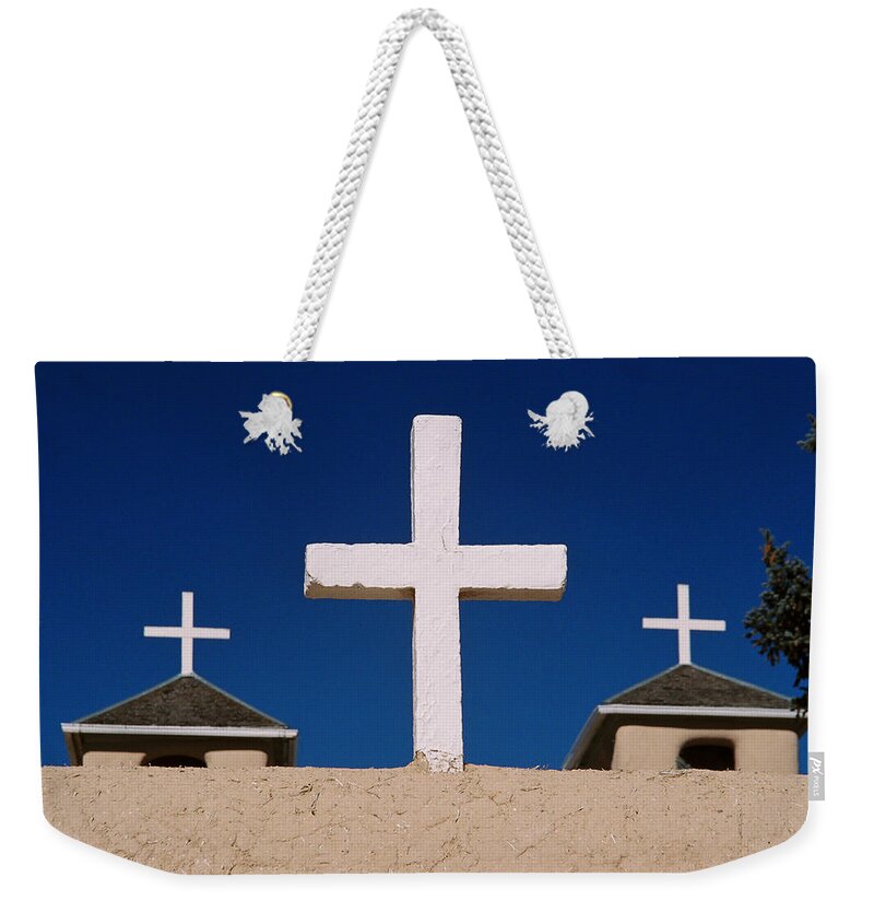 Taos Weekender Tote Bag featuring the photograph Crosses Of San Francisco De Asis by Ron Weathers