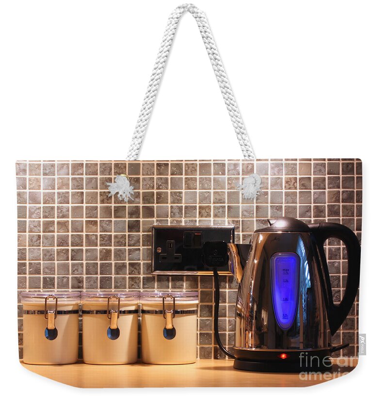 Kitchen Weekender Tote Bag featuring the photograph Electric kettle and cup by Simon Bratt