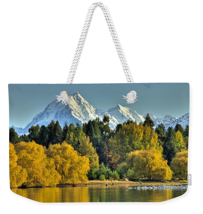 00462458 Weekender Tote Bag featuring the photograph Fall Willow And Cottonwoods At Lake by Colin Monteath