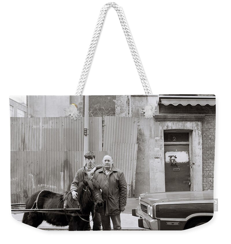 London Weekender Tote Bag featuring the photograph Father And Son #1 by Shaun Higson