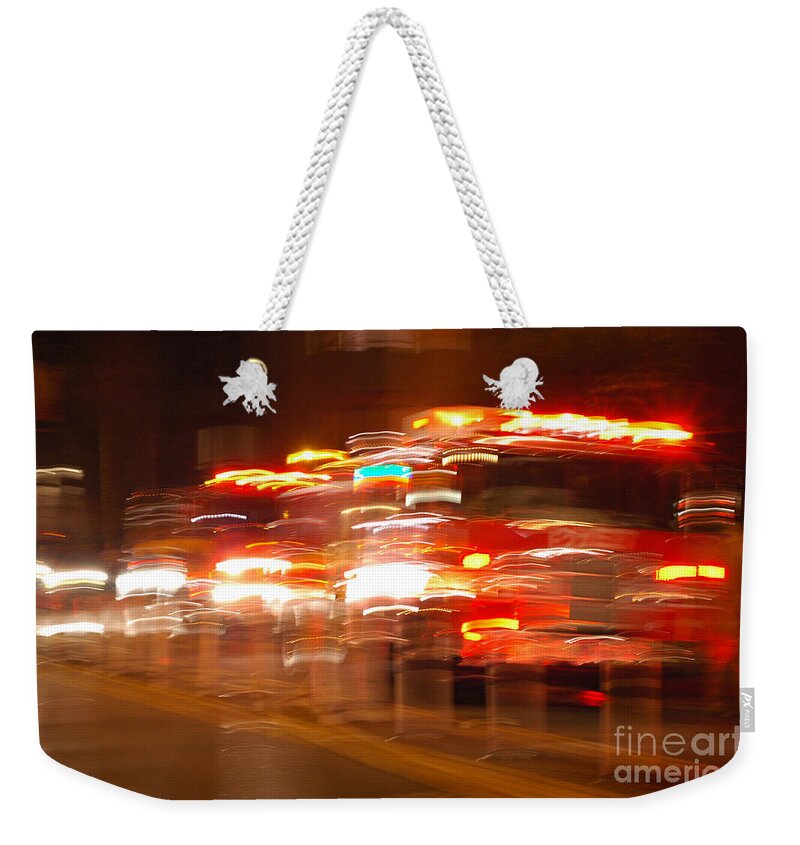 Motion Weekender Tote Bag featuring the photograph Fire truck by Micah May