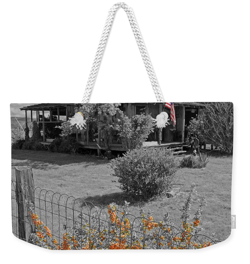 Special Effect Weekender Tote Bag featuring the photograph Flowers and A Flag by Mick Anderson