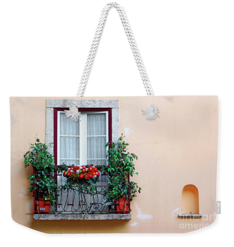 Alfama Weekender Tote Bag featuring the photograph Flowery Balcony by Carlos Caetano