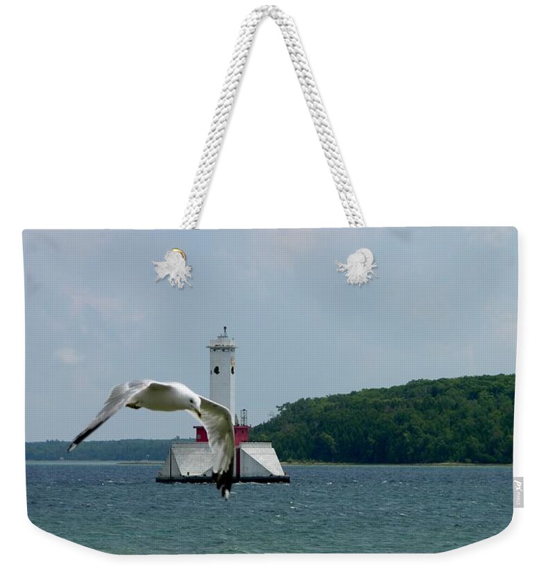 Sea Gull Weekender Tote Bag featuring the photograph Gull and Lighthouse by Keith Stokes