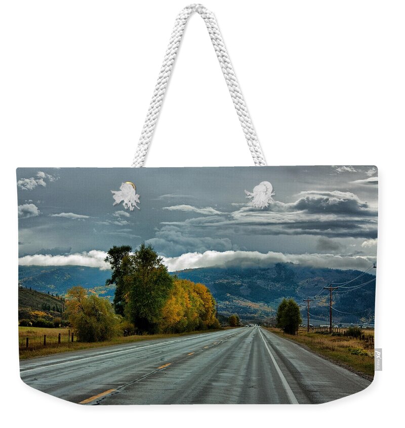 Rocky Mountains Weekender Tote Bag featuring the photograph High in Colorado by Farol Tomson