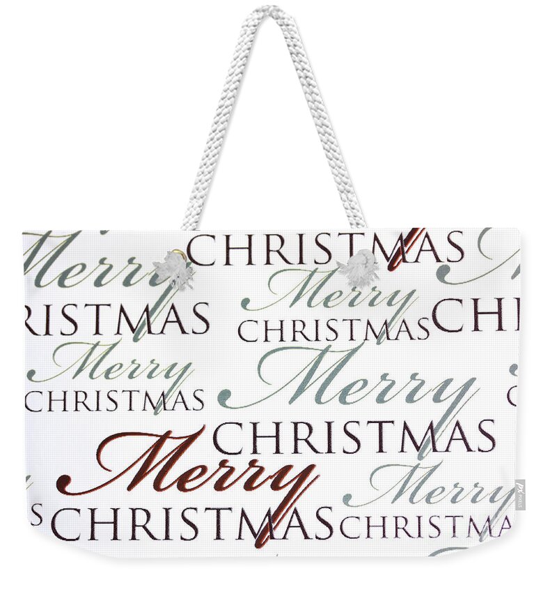 Merry Weekender Tote Bag featuring the photograph Merry Christmas words by Simon Bratt
