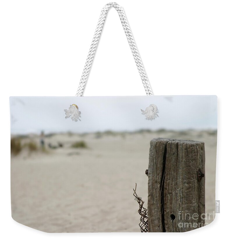 Old Weekender Tote Bag featuring the photograph Old Fence Pole by Henrik Lehnerer