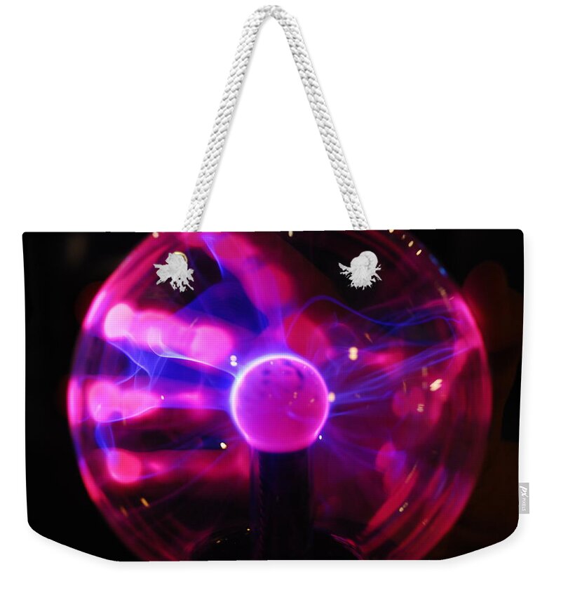 Plasma Weekender Tote Bag featuring the photograph Plasma Hand by Michael Merry