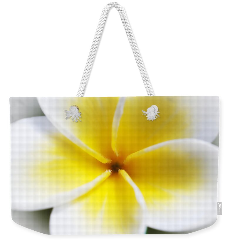 Artistic Weekender Tote Bag featuring the photograph Plumeria Center by Joe Carini - Printscapes