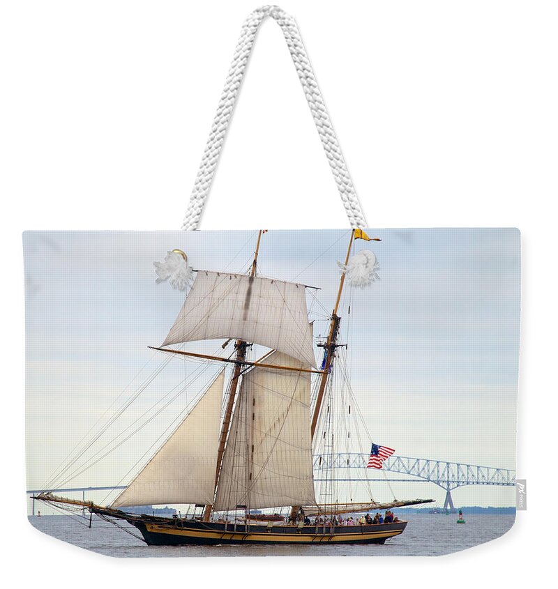 Baltmore Weekender Tote Bag featuring the photograph Pride of Baltimore II in front of the Harbor Bridge by Mark Dodd