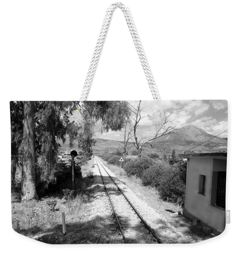 Railroad Weekender Tote Bag featuring the photograph Railroad Crossing in Black and White on the Way from Mycenae to Olympia in Greece by John Shiron