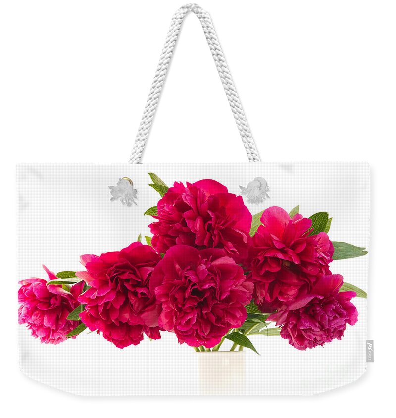 Peony Weekender Tote Bag featuring the photograph Red Peonies by Ann Garrett