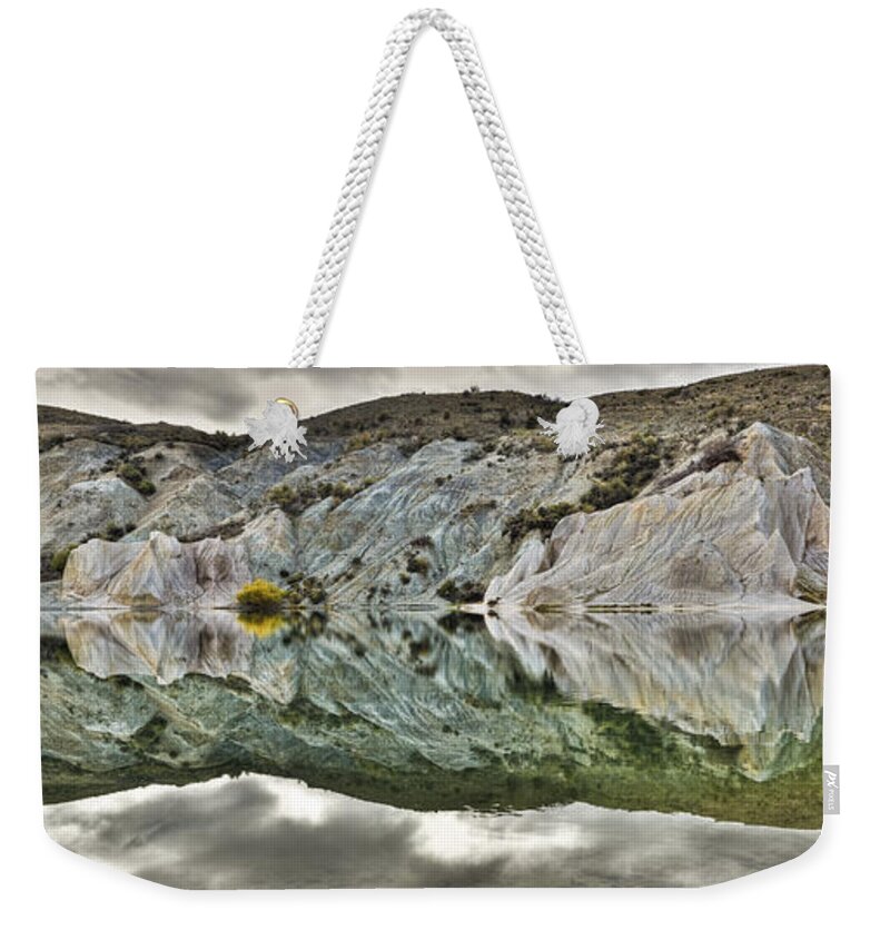 Hhh Weekender Tote Bag featuring the photograph Reflection On Blue Lake, St Bathans by Colin Monteath
