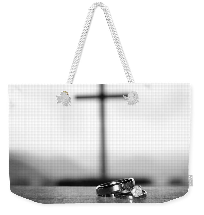 Engagement Weekender Tote Bag featuring the photograph Rings and Cross by Kelly Hazel