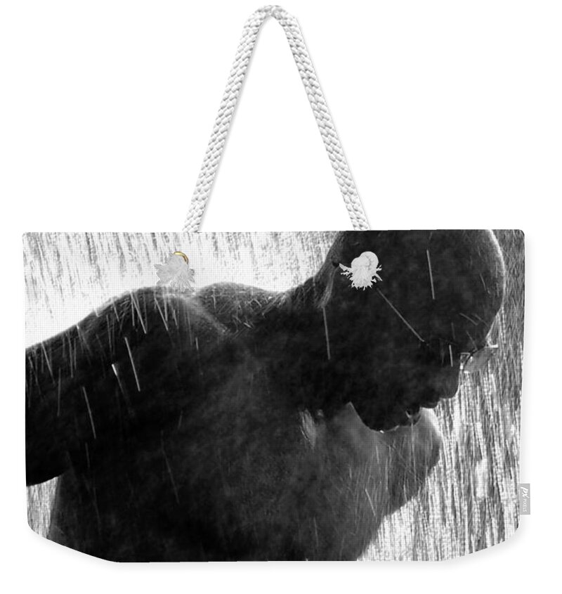 Road Race Weekender Tote Bag featuring the photograph Runner in the Spray by Kathleen K Parker