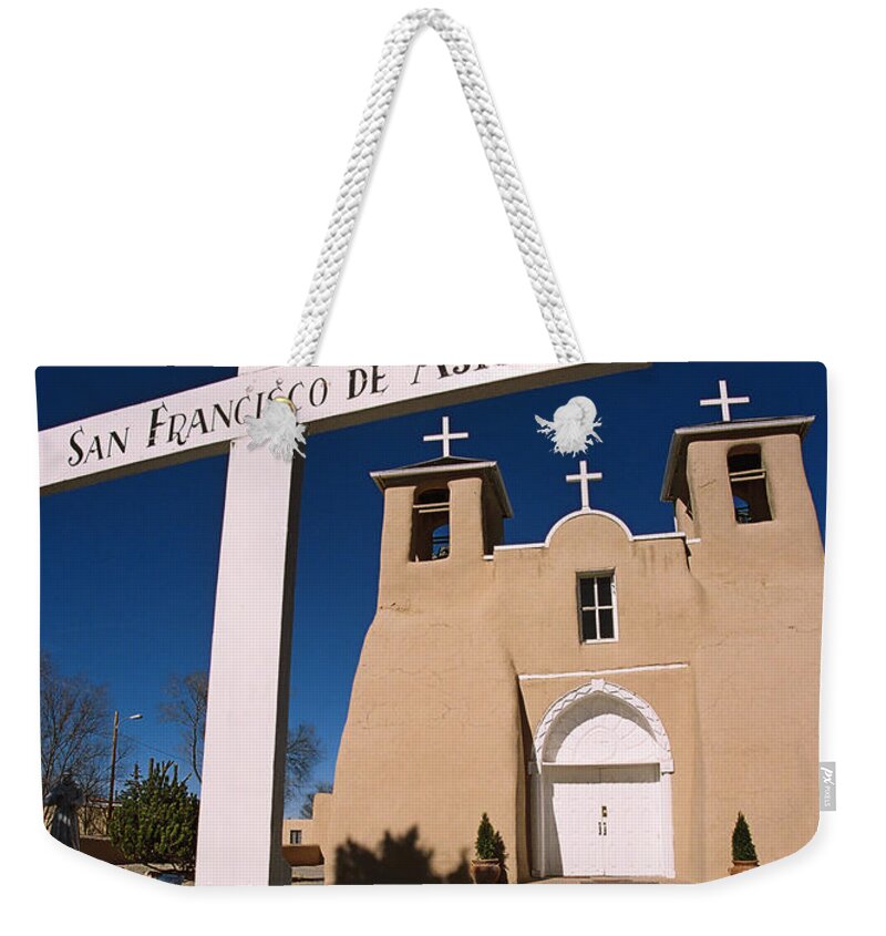 Taos Weekender Tote Bag featuring the photograph San Francisco De Asis by Ron Weathers