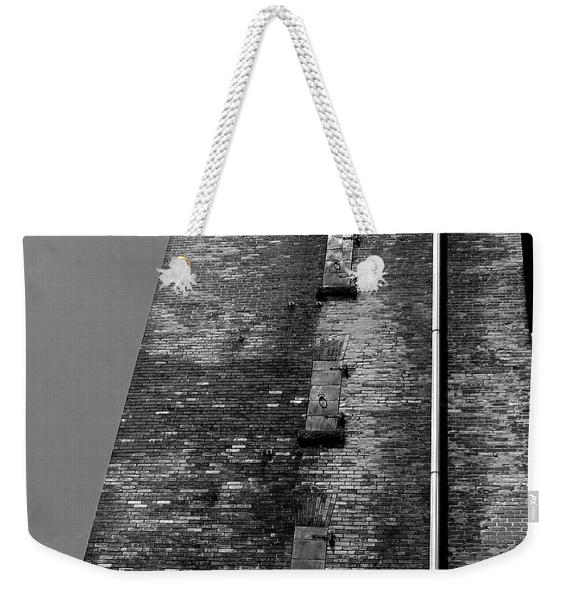  Weekender Tote Bag featuring the photograph Shipping Building by Mark Valentine