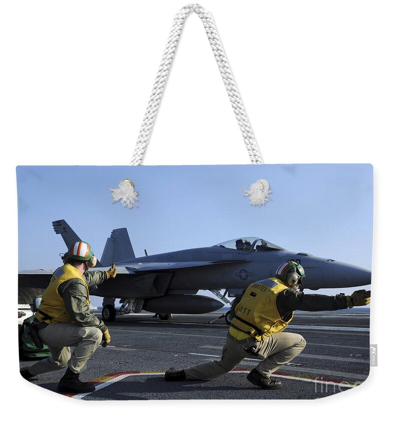 Aircraft Weekender Tote Bag featuring the photograph Shooters Aboard The Uss George H.w by Stocktrek Images