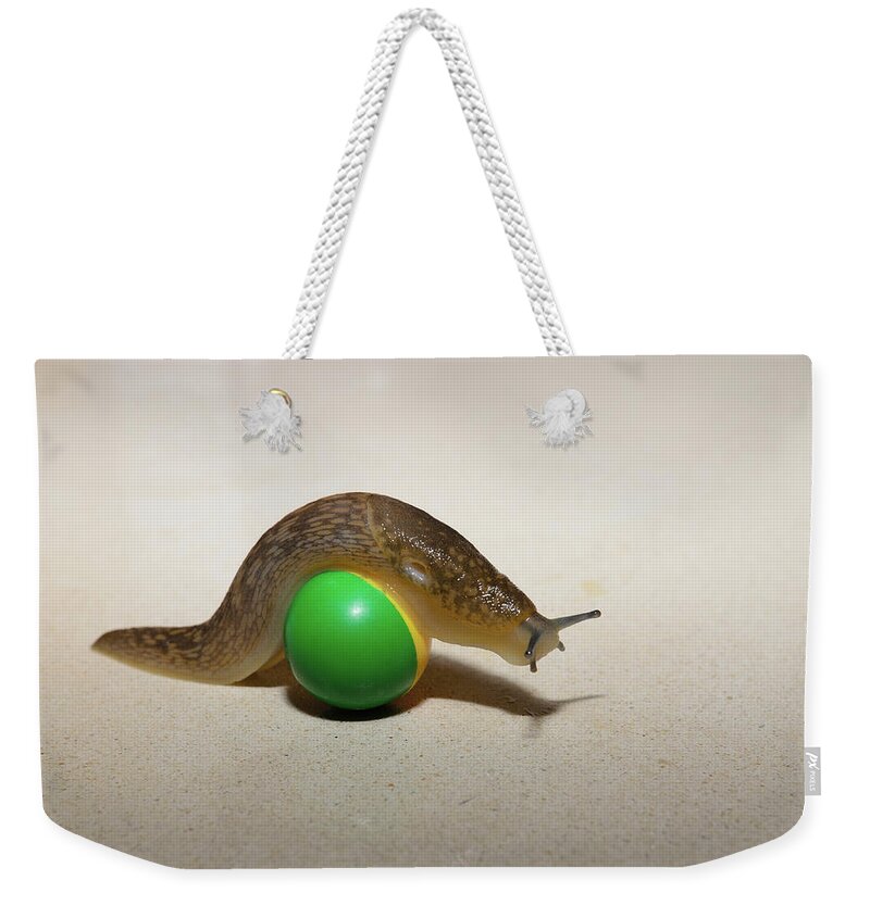 Ball Weekender Tote Bag featuring the photograph Slug on the ball by Michael Goyberg